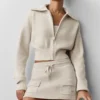 Krótka kurtka z dzianiny typu „Scholar” z zamkiem na całej długości – owsiano-melanżowa