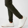 Spodnie sportowe Conquer React – zielone „Stealth”