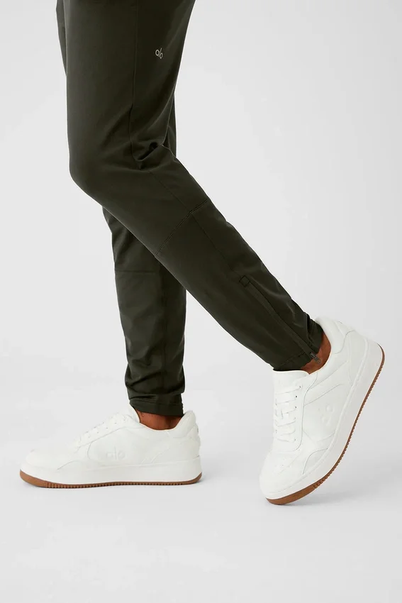 Spodnie sportowe Conquer React – zielone „Stealth”